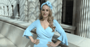 Katya in a pale blue dress and fascinator